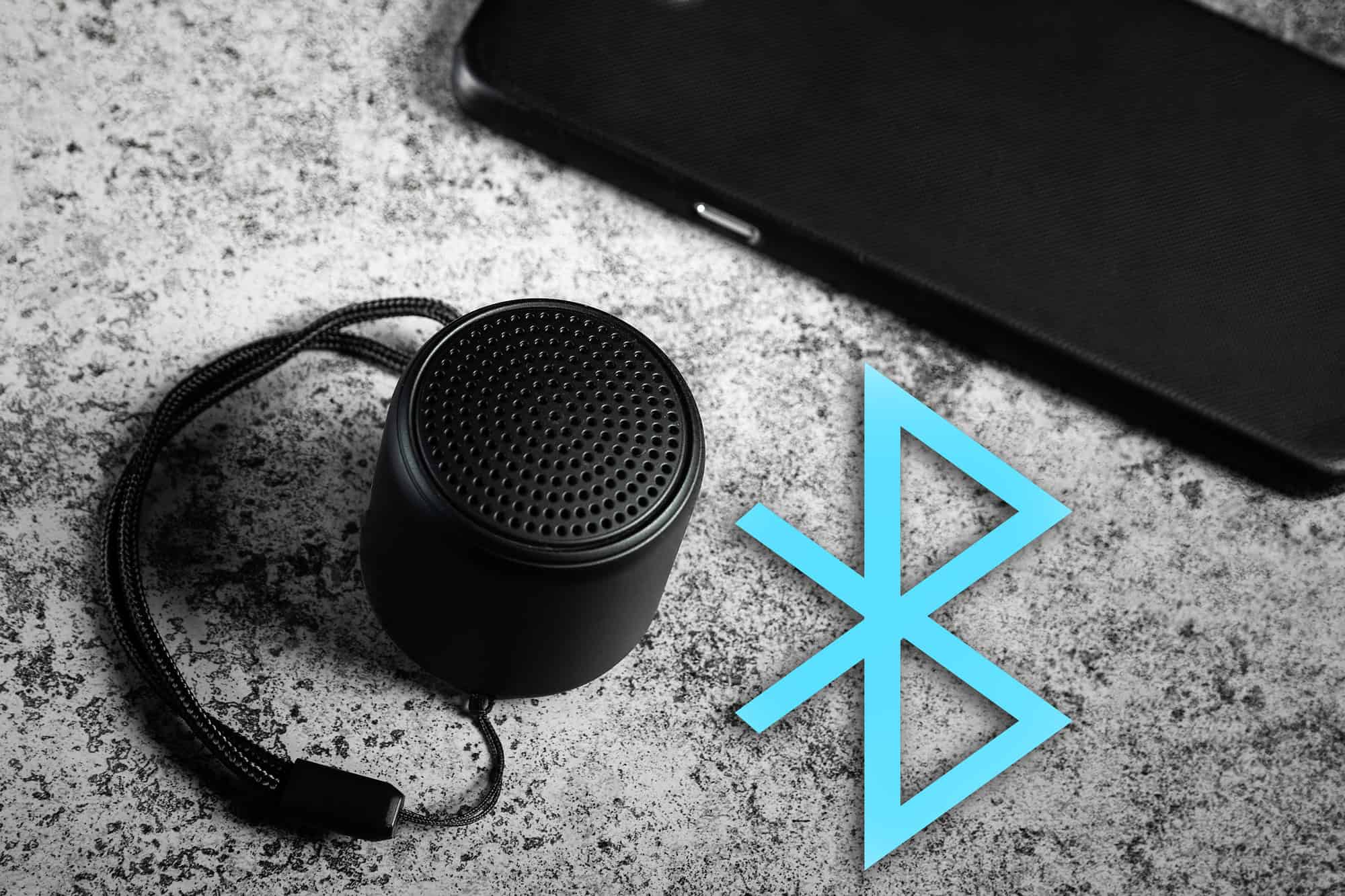 Bluetooth logo next to a Bluetooth speaker